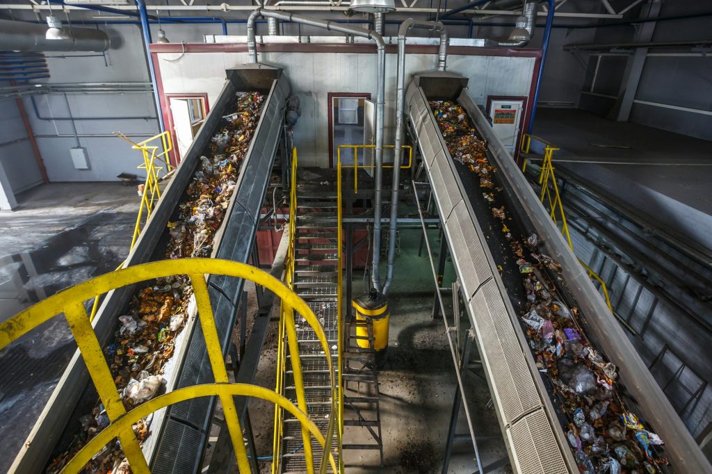 moving conveyor transporter on Modern waste recycling processing plant.